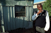 South Africa, Khayelitsha-township.. A Zulu-man in front of his home.