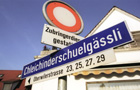 Image of a streetname sign in swiss german language also called  Schwyzerdeutsch. Click to see swiss gallery.